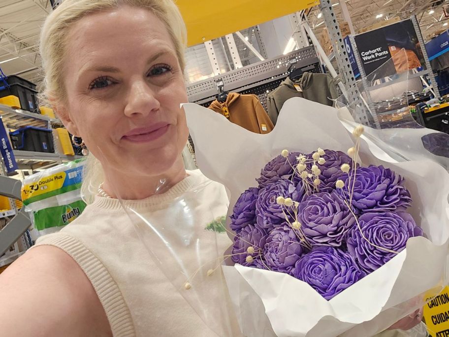 stefanie holding Lowe&rsquo;s Paper Flower Bouquet in store