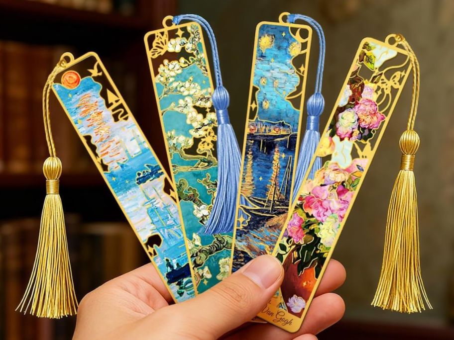 hand holding four unique bookmarks