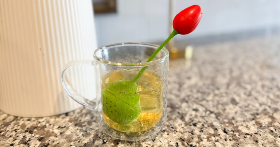 red Tulip Tea Infuser in a mug of tea