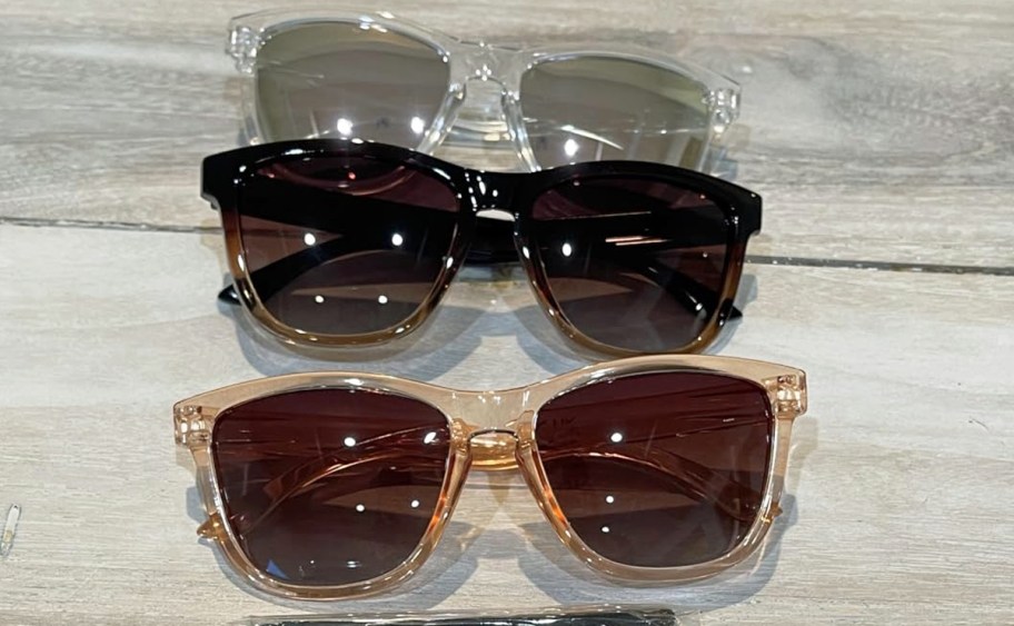 3 pairs of sunglasses on a table