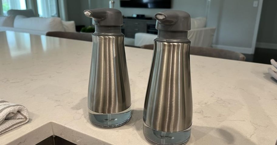 two oxo soap dispensers displayed in the kitchen 