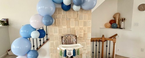 Blue and white PartyAire Balloon Arch Kit over a high chair