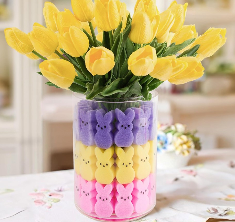 yellow tulips in a vase filled with peeps-shaped sponges