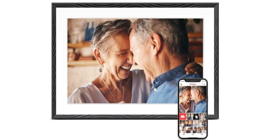 stock image of photo frame with phone next to it 