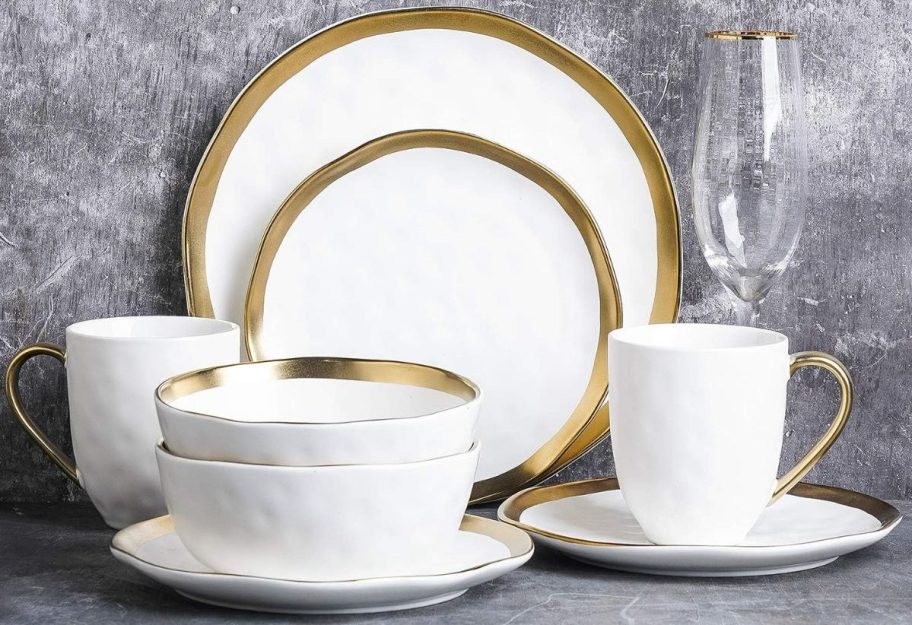 white and gold Plates on top of the table