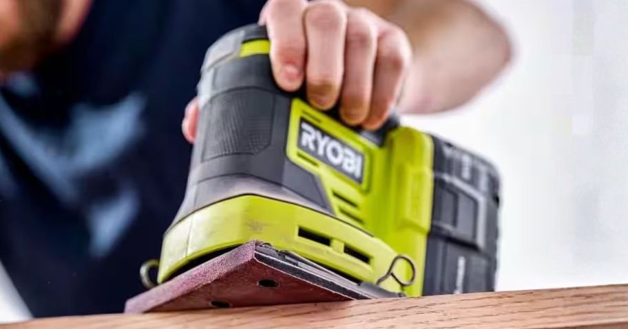 person using RYOBI ONE+ 18V Cordless Sheet Sander