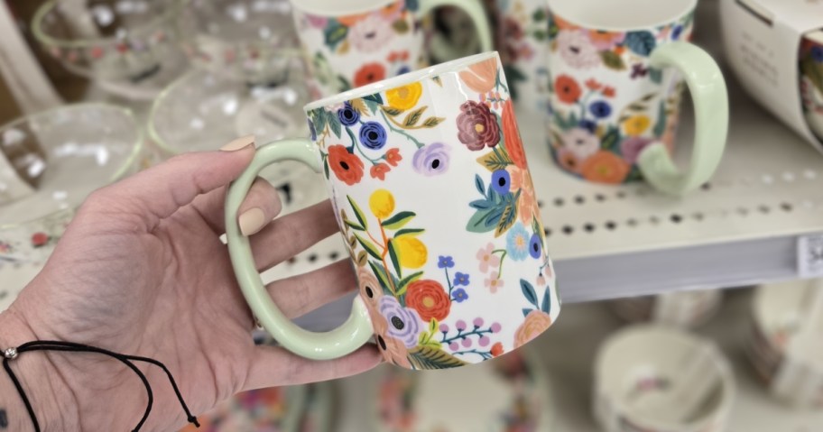 person holding Rifle Paper Co. Garden Party Coffee Mug in store