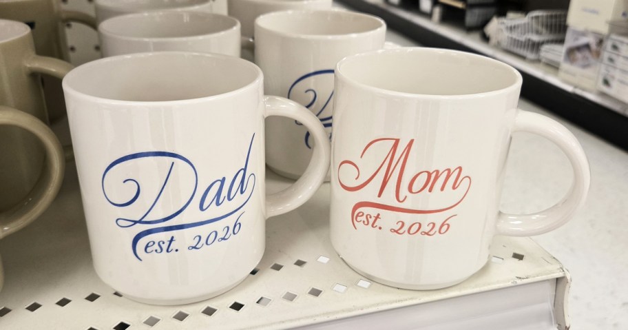 dad & mom est 2026 mugs on store shelf