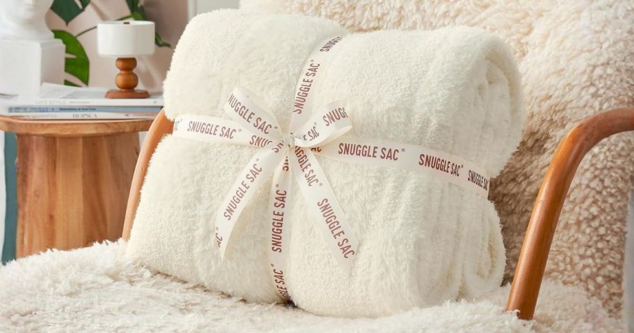 Snuggle Sac Throw Blanket folded on chair