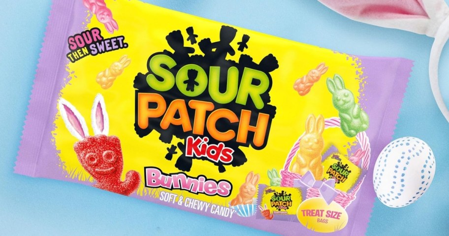 bag of sour patch kids bunnies with blue background and easter egg