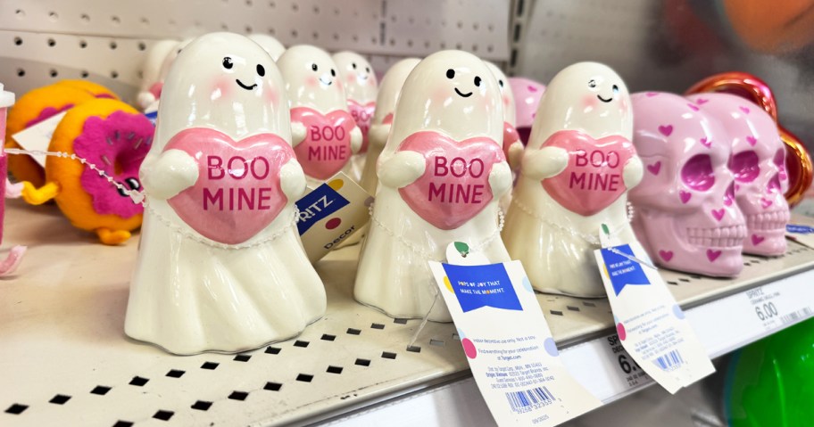 ghost figurines holding a heart that says "boo mine"