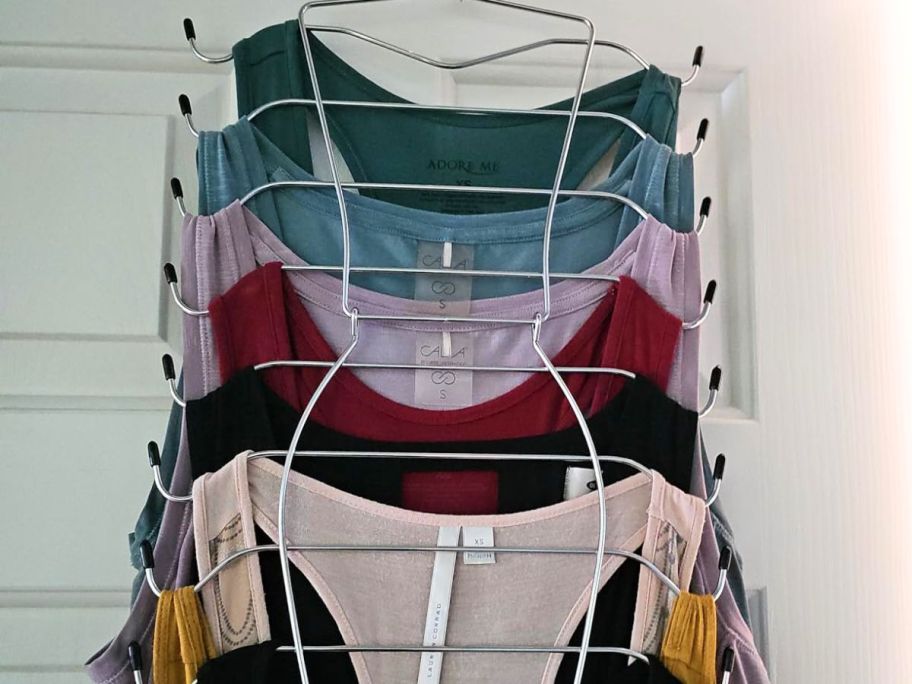 A Tank-Top Hanger with several tank tops on it