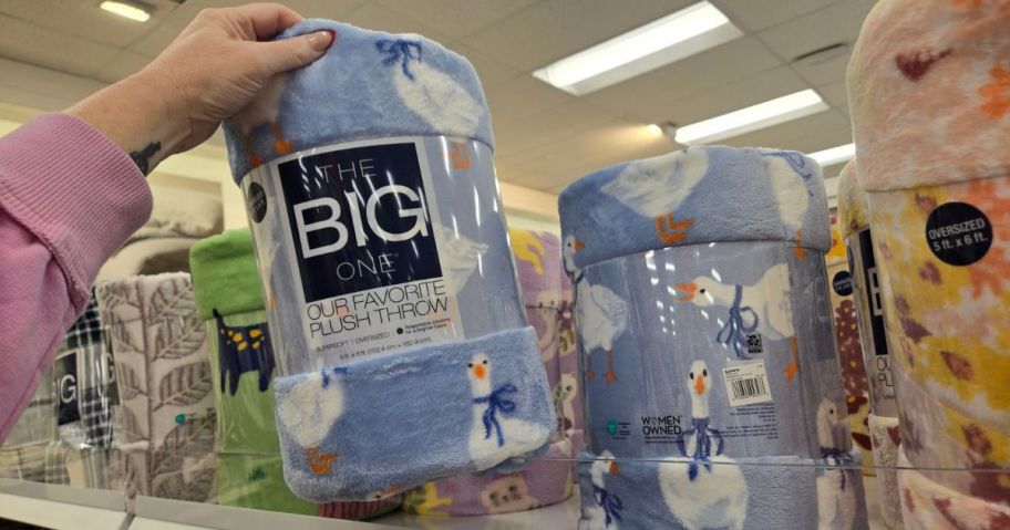 hand holding silly goose The Big One Oversized Supersoft Plush Throw Blanket in store