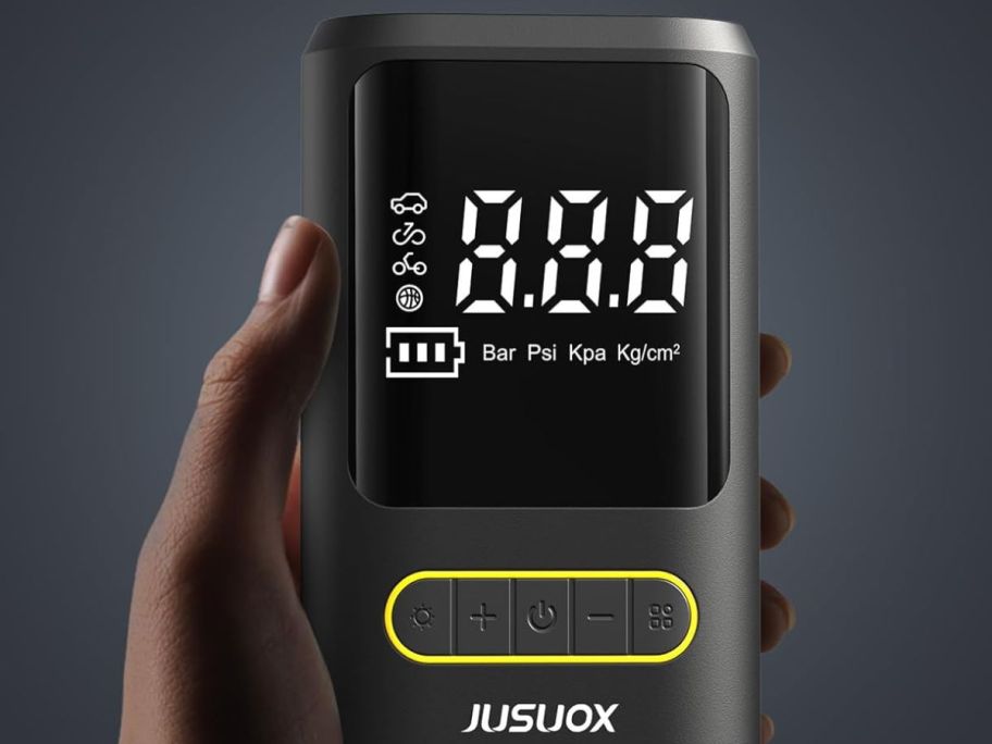 hand holding tire machine