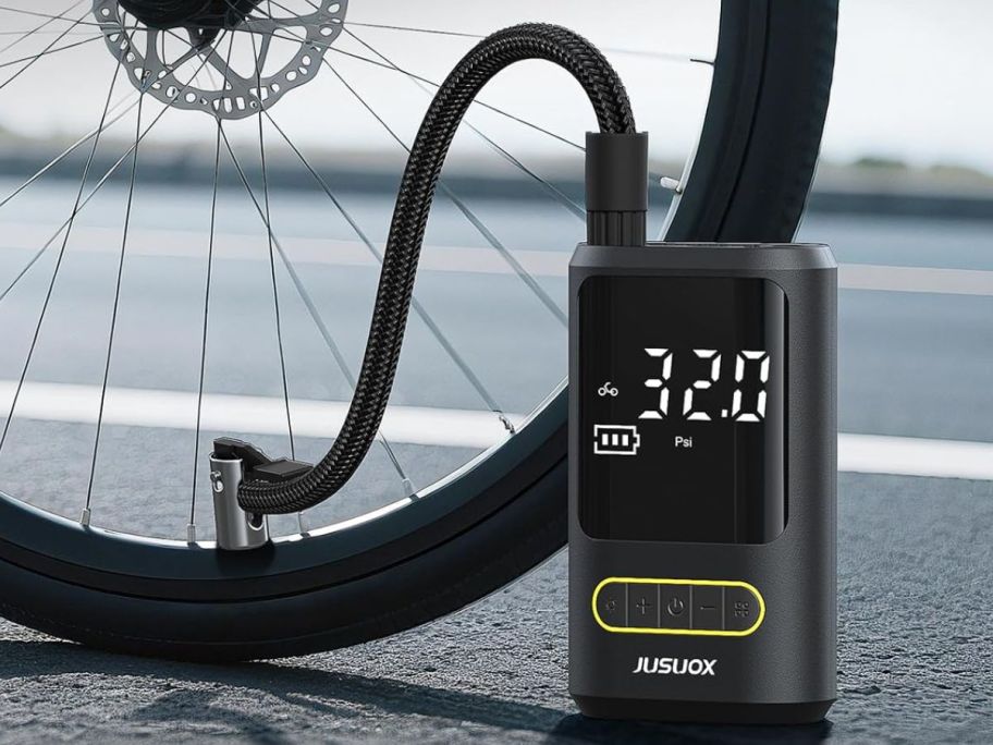 Tire pressure machine being used on a bike