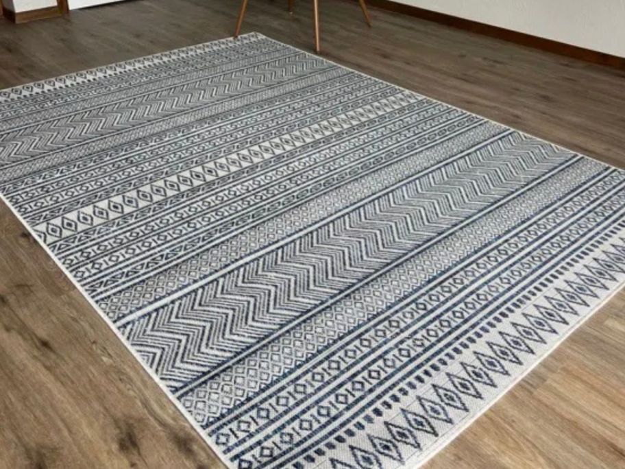 Wade Logan Laruth Tribal 7' x 10' Area Rug in bedroom