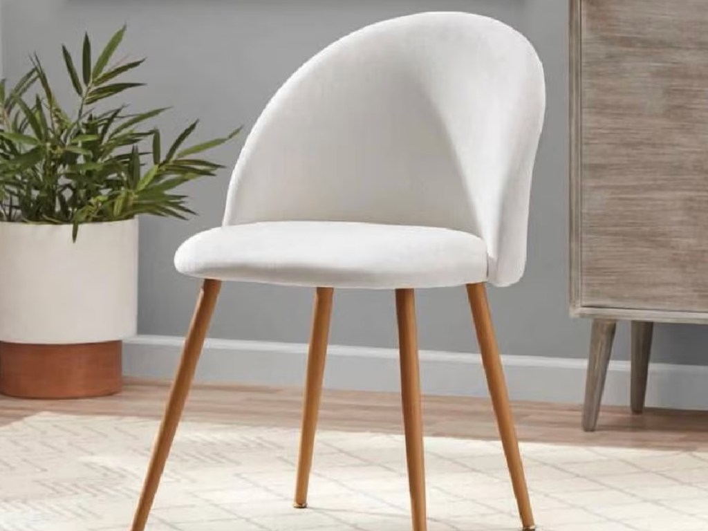 White chair with wooden legs