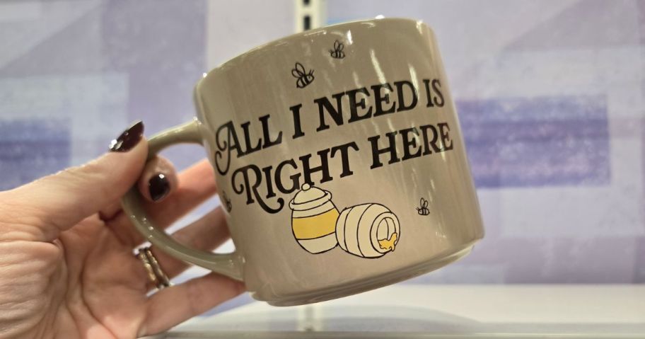 Winnie the Pooh mug in womans hands
