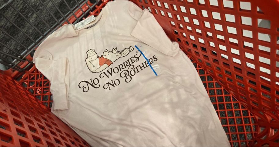 Winnie the Pooh shirt inside of shoppign cart