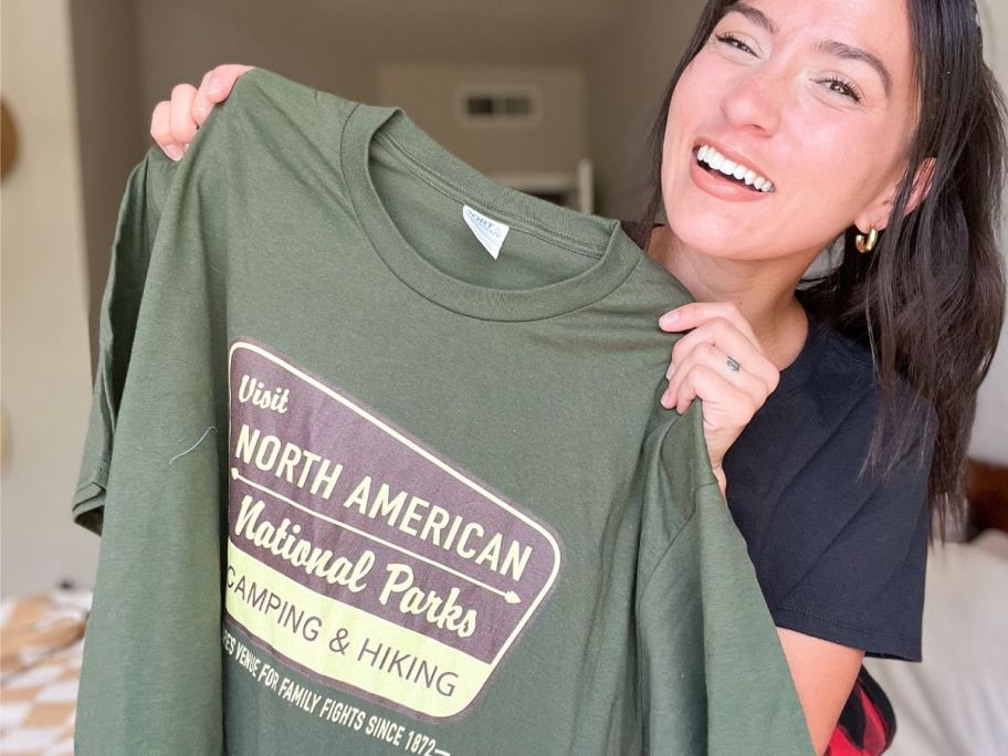 Woman holding a Woot Shirt