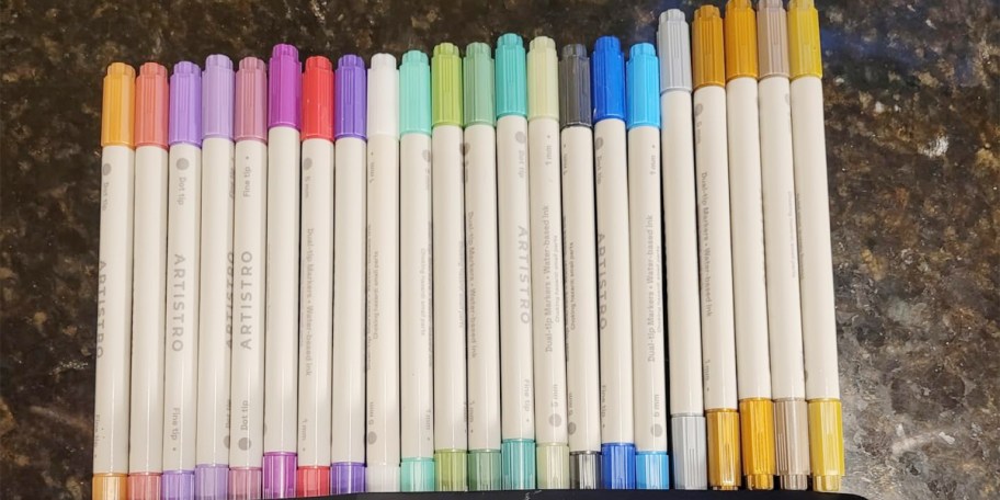 paint markers laying on counter