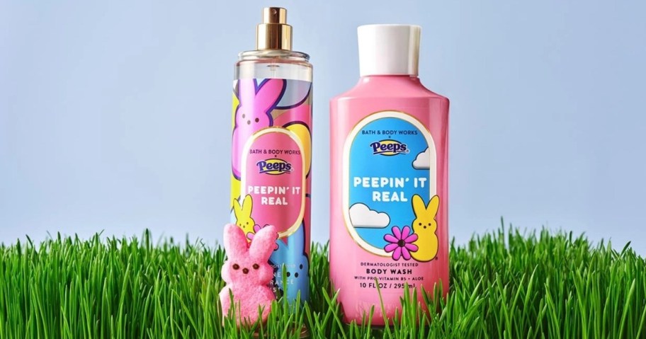 Image of a pink bottle of body wash and a spray mist featuring colorful illustrations inspired by marshmallow Peeps. The products are set against a light blue background with green grass in the foreground.