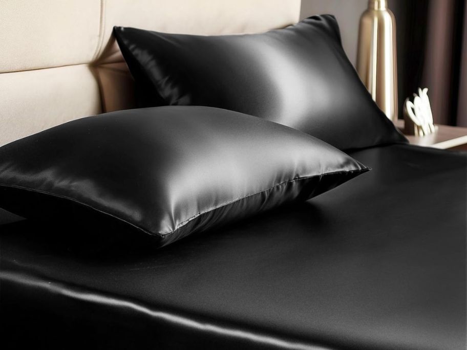 black satin sheets on bed