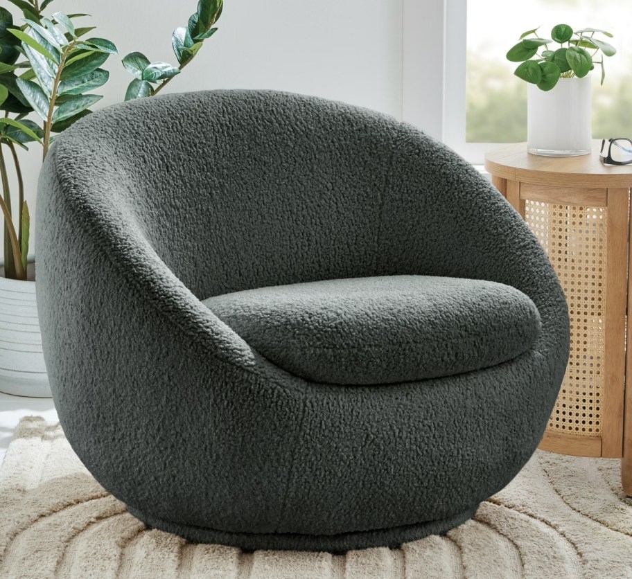 a gray sherpa swivel chair