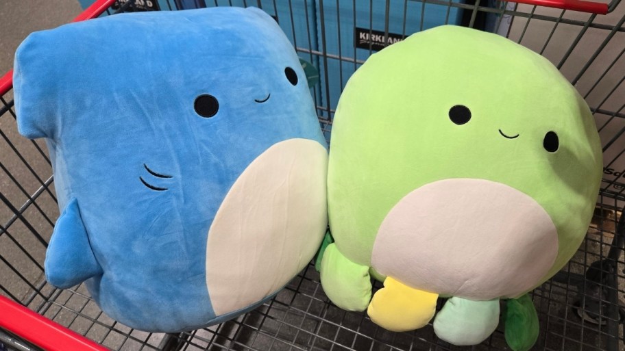 blue and green squishmallows in a shopping cart