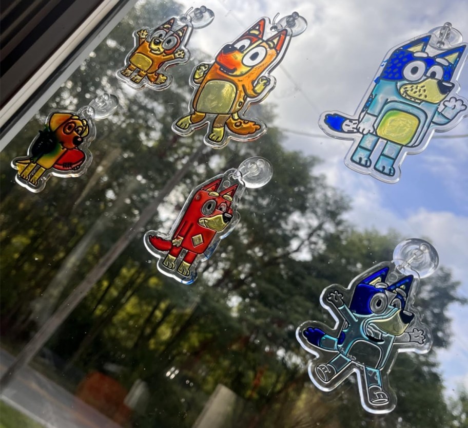 bluey suncatchers on a window