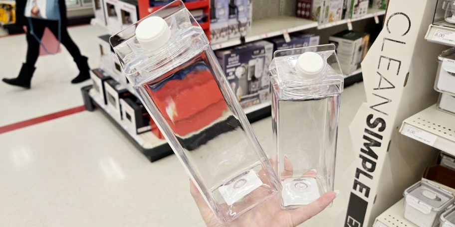 hand holding carafes