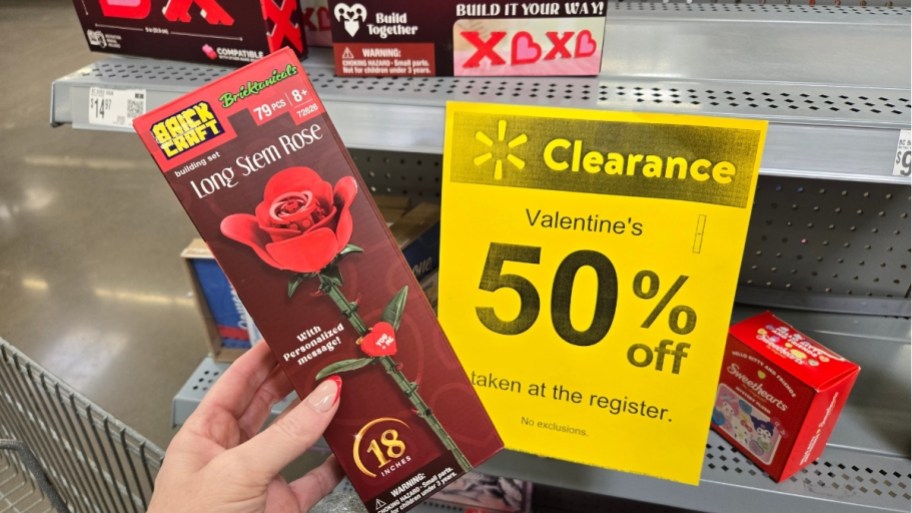 Woman's hands holding a prefabricated brick rose