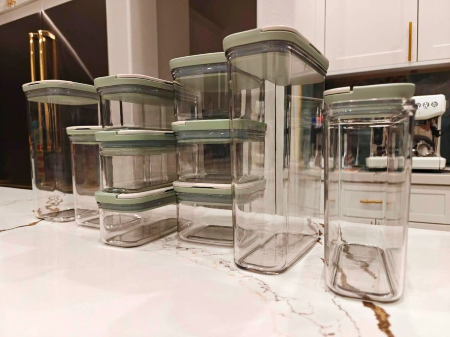 a set of clear food storage containers on a kitchen counter