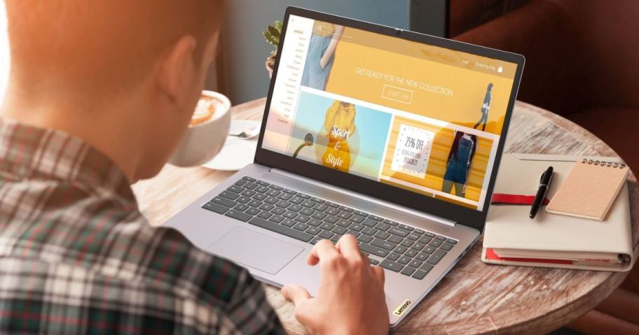 man using his laptop on top of the table