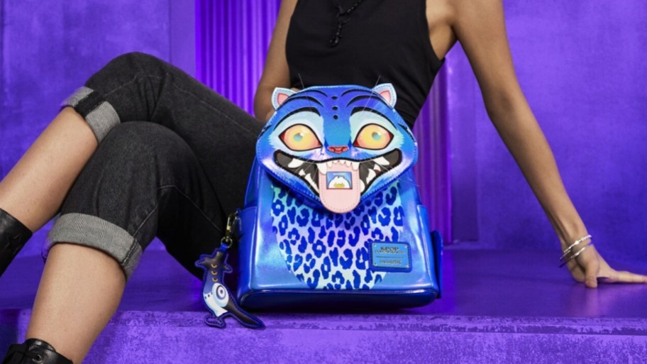 a woman with a mini backpack