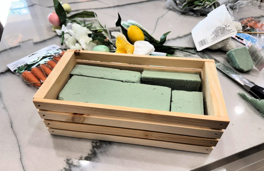 dollar tree crate with floral foam inside