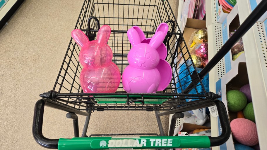 two pink plastic bunnies, one translucent and one opaque, in a dollar tree cart