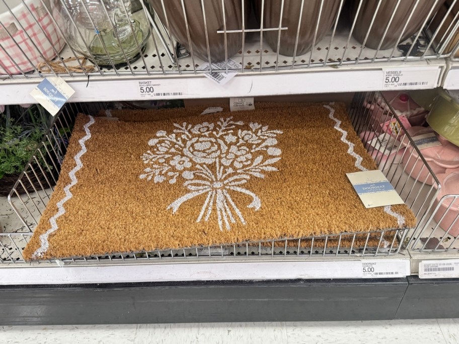 a coir doormat with a bouquet printed on it