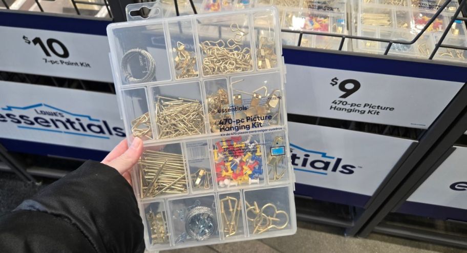 hand holding a lowes hanging set 