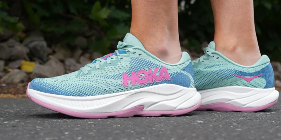 person wearing blue and pink shoes 