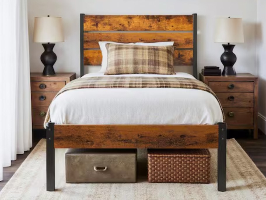 wood twin bedframe with white and plaid comforter