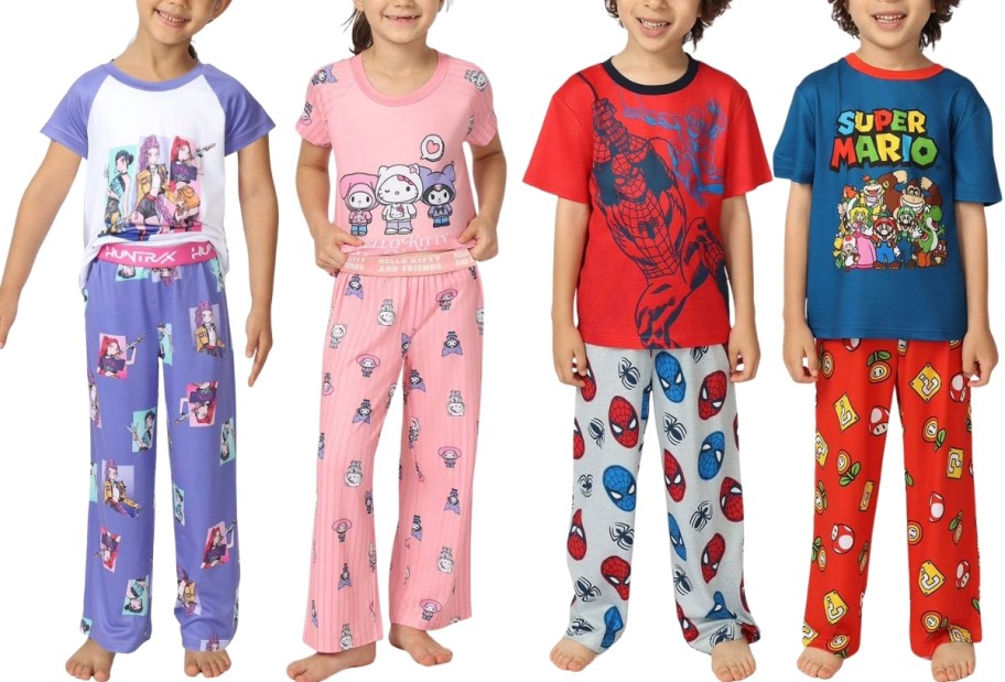 four kids wearing character pajama sets