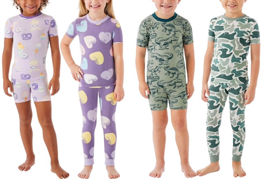 four kids wearing graphic print pajama sets
