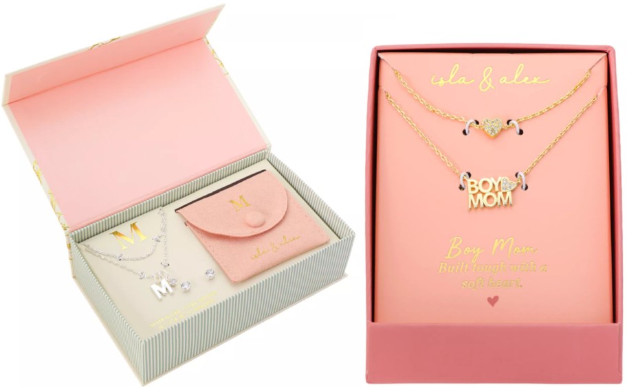 A jewelry box with a striped design and a peach interior contains a silver necklace featuring the letter 