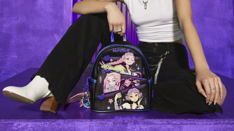 a woman with a mini backpack