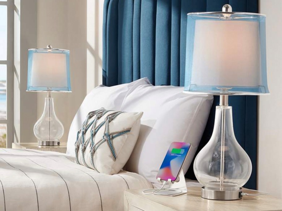 clear lamps with blue shade on nightstands in bedroom