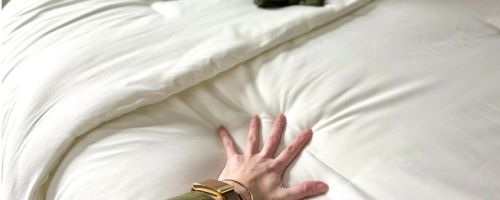 Hand pressing on a Litanika comforter