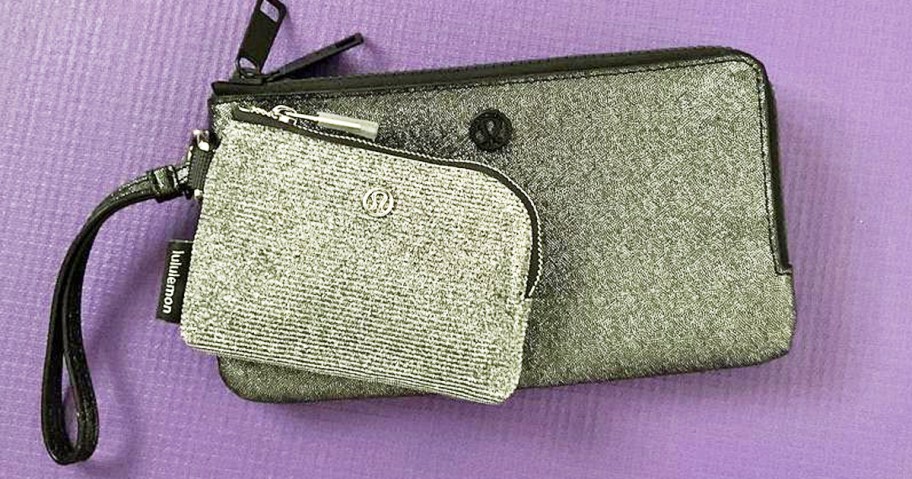 sparkly lululemon pouch and wristlet on a purple background