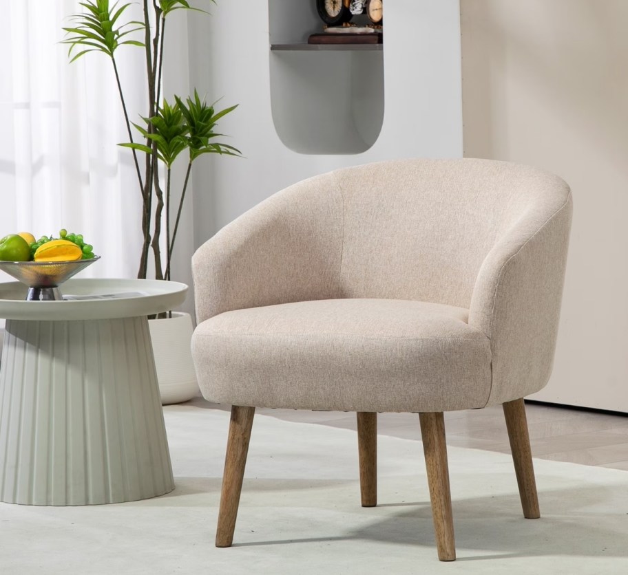 a beige upholstered accent chair