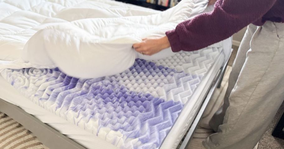 chelsey pulling pillow top mattress topper over memory foam topper on bed